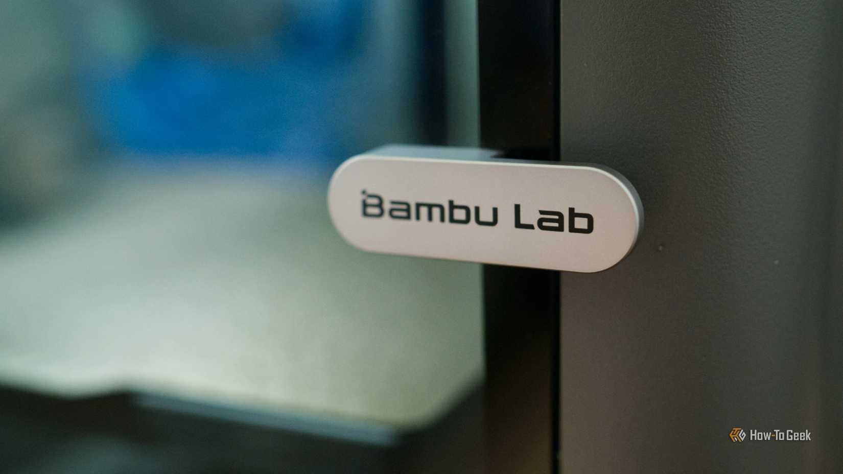 Bambu Lab P2S 3D printer handle logo closeup.