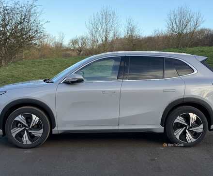 Static side profile shot of a gray 2026 Geely EX5 Max.