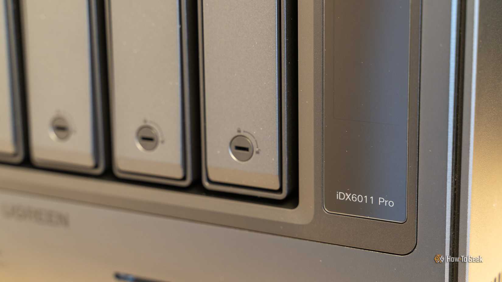 The drive bay locks and iDX6011 Pro model badge on the right side of the Ugreen NAS front panel.