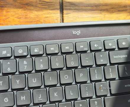 The Logitech Signature Slim Solar+ K980 wireless keyboard charging in the sun.