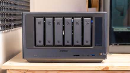 The Ugreen iDX6011 Pro NAS front panel showing all six numbered drive bays and connectivity ports.