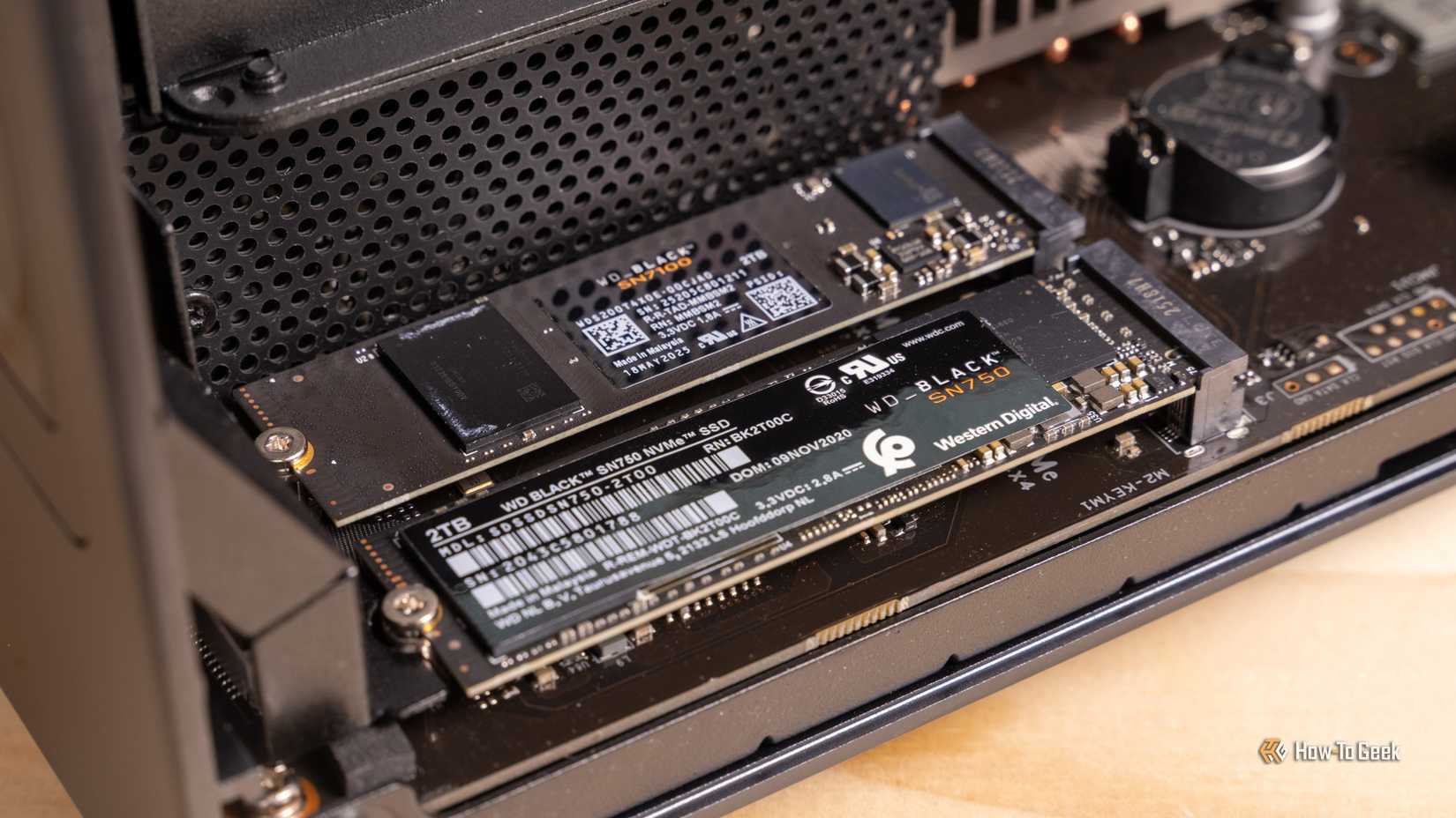 Two WD Black NVMe SSDs installed in the two M.2 slots of the Ugreen iDX6011 Pro NAS motherboard.
