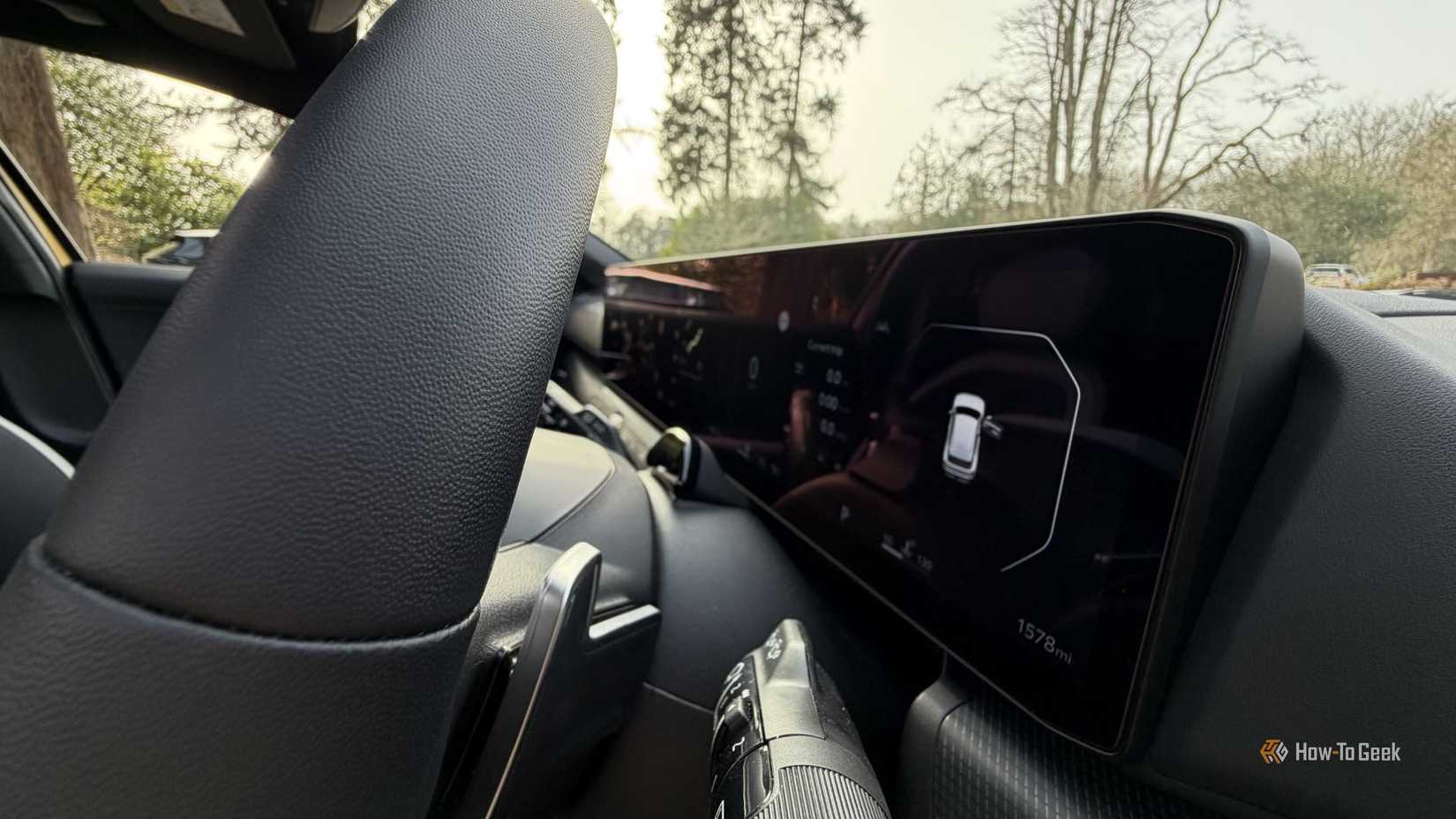 Close-up shot of the panoramic digital display on the dashboard of a 2026 Kia K4 Hatchback.