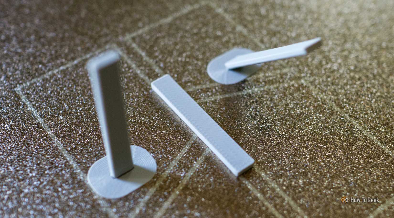 3D printed objects on a build plate.