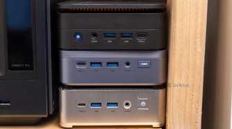 A cluster of three mini PCs stacked on top of each other for high availability.