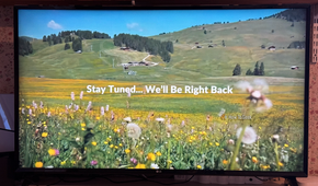 An LG TV displaying a message saying stay tuned we will be right back.