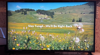 An LG TV displaying a message saying stay tuned we will be right back.