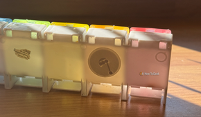 An NFC tag sticker on the back of a medication storage box.