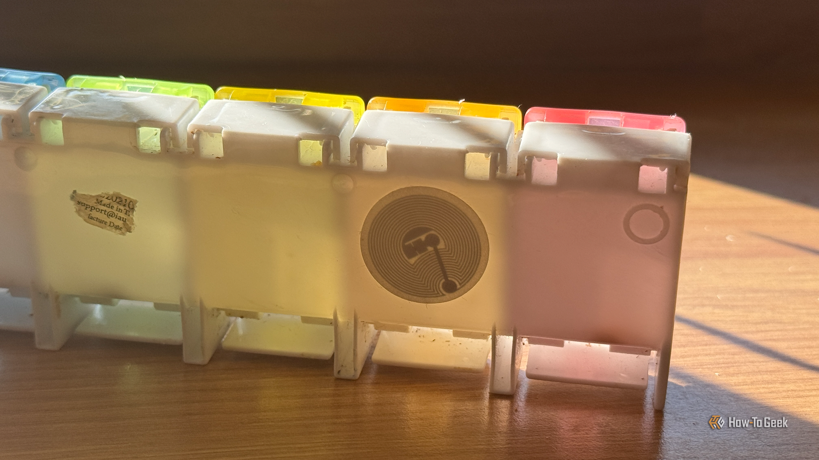 An NFC tag sticker on the back of a medication storage box.