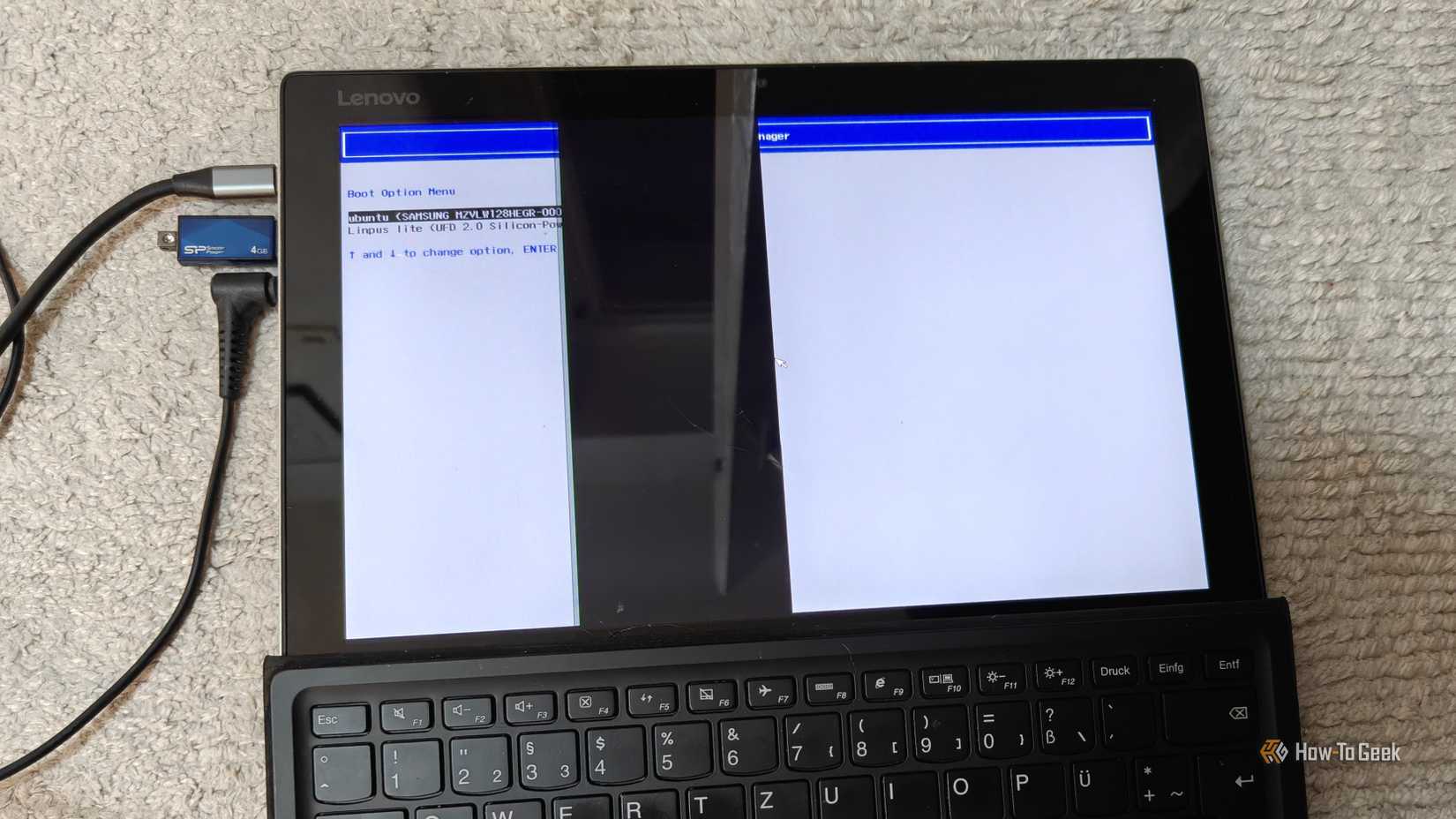 A laptop with a broken screen running Linux Ubuntu.