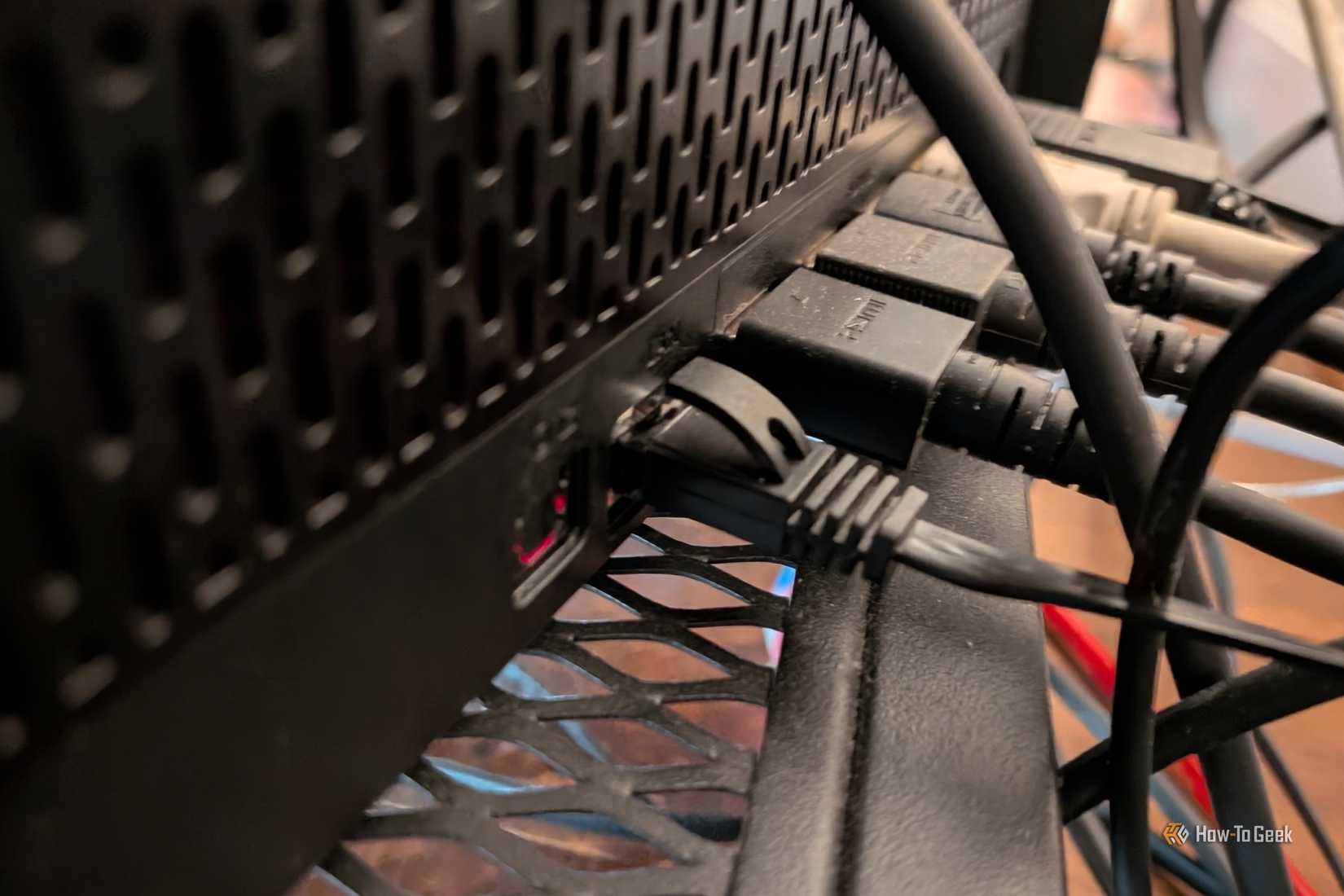 Ethernet cable plugged into the back of a Samsung Frame TV One Connect box.