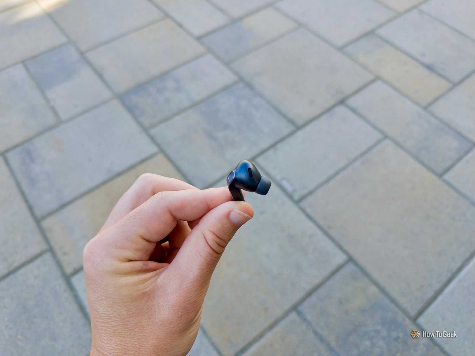 Individual Samsung Glaxay Buds4 Pro held in hand.