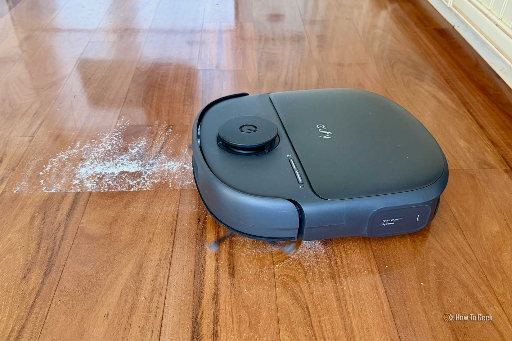 Eufy Omni C28 cleaning flour on a hardwood floor.