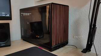 An ITX PC Tower stands on a desk.