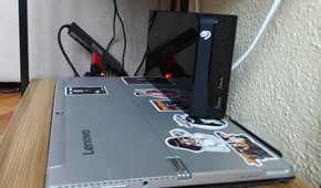 A laptop with an external hard drive operating as a NAS.