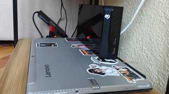 A laptop with an external hard drive operating as a NAS.