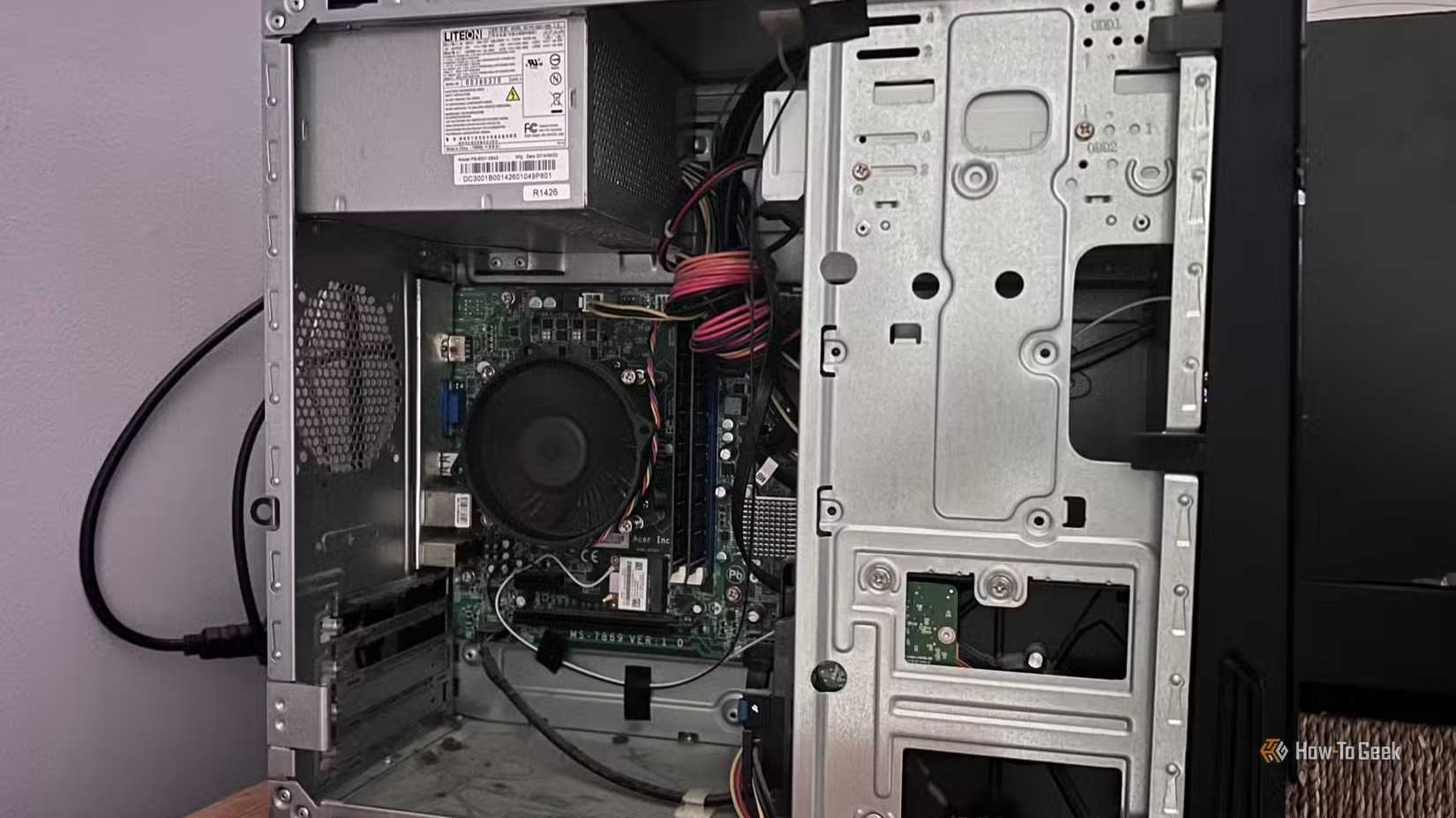 An Acer desktop computer with the side panel off.
