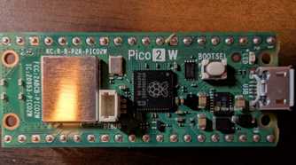 Top-down shot of a Pico 2 W with GPIO header.