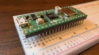 The Pico 2 W sitting on a breadboard.