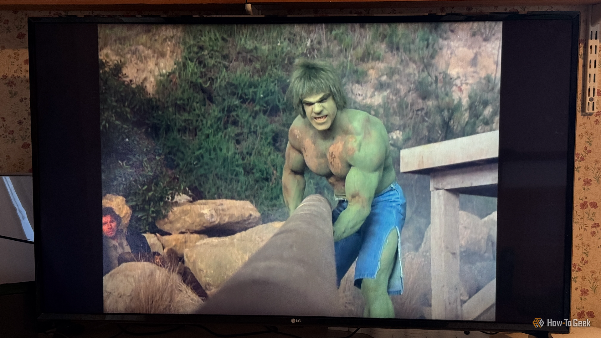 The Incredible Hulk moving a heavy pipe on LG Channels.