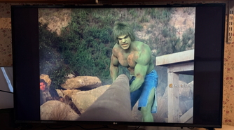The Incredible Hulk moving a heavy pipe on LG Channels.