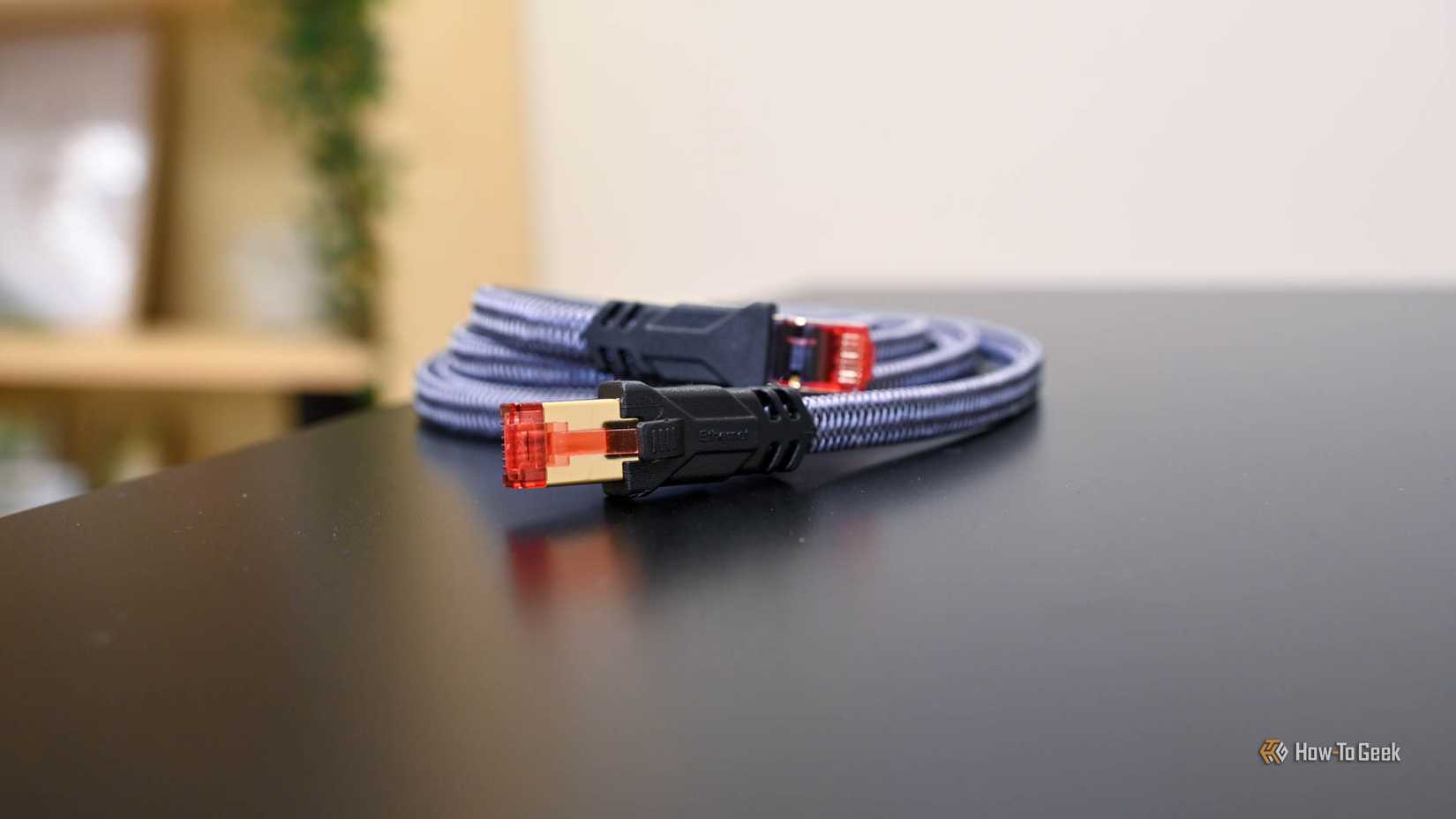 A coiled ethernet cabling laying on a table. 