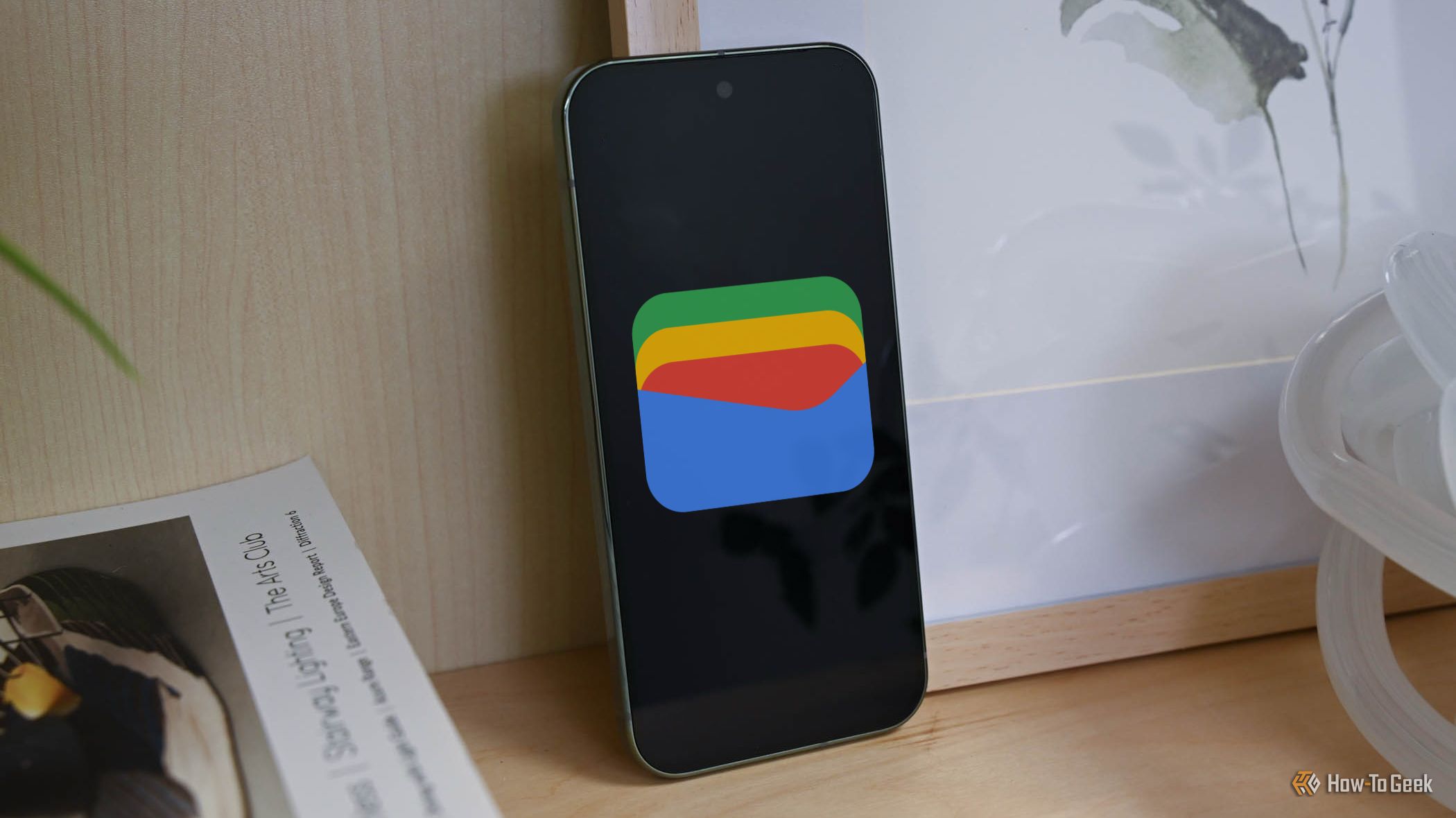 A Pixel phone with the Google Wallet icon on screen.