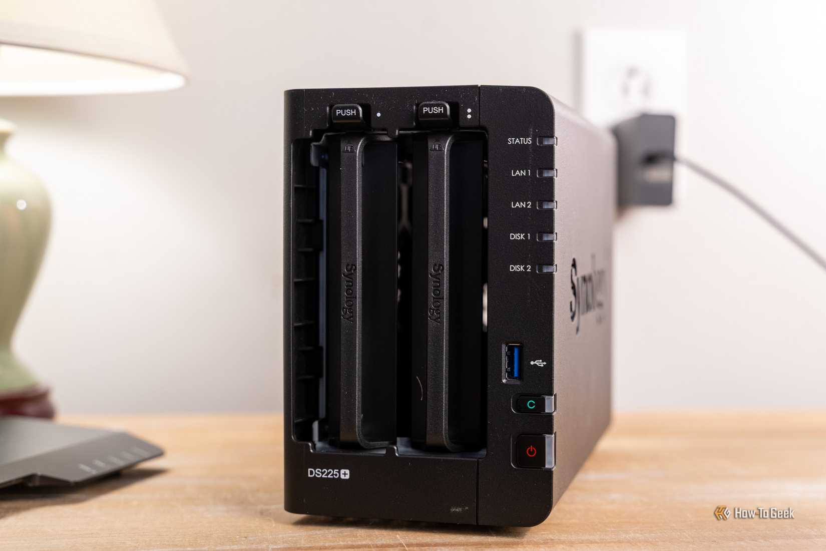 Front view of the Synology DS225 Plus 2-bay NAS with both drive trays installed.