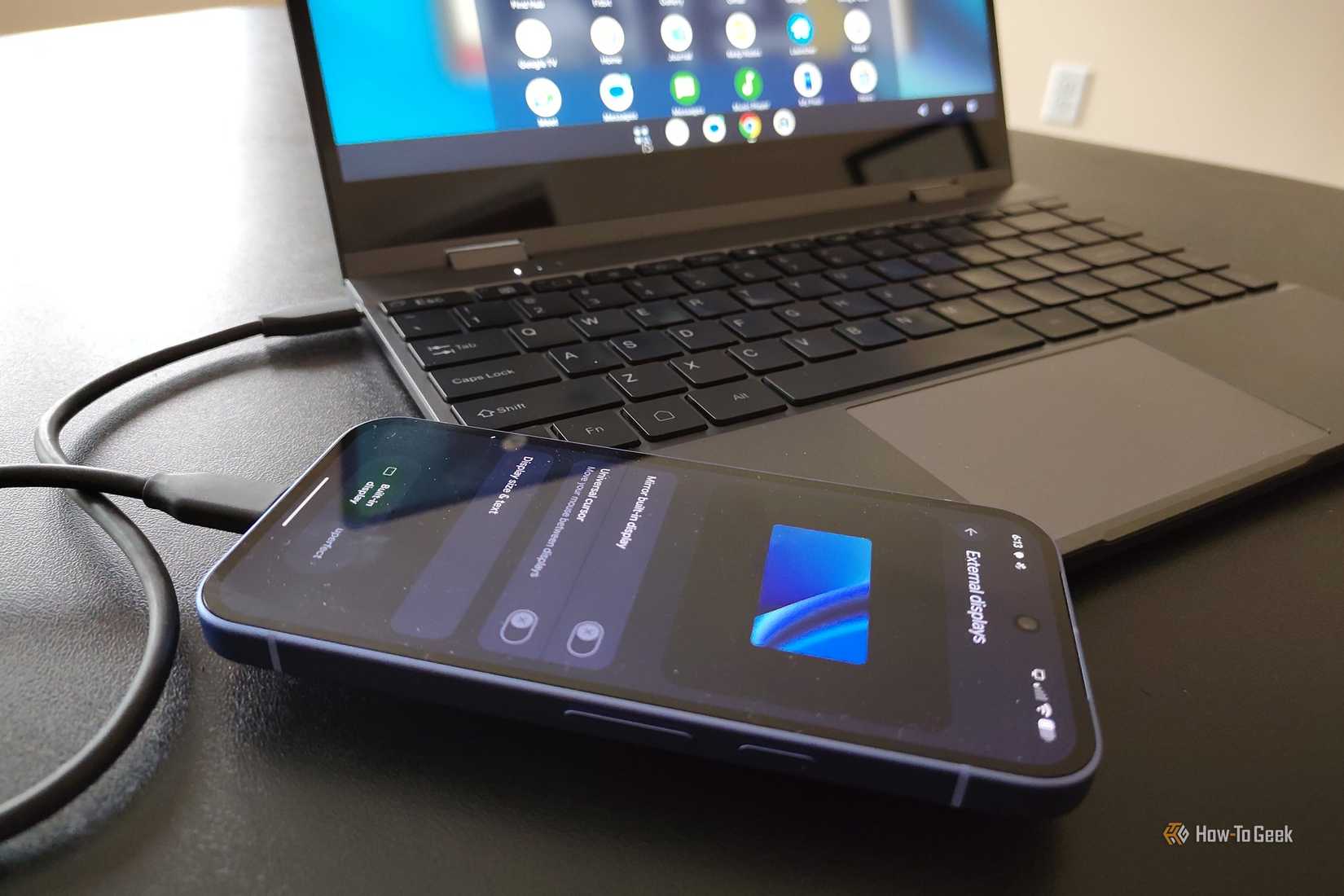 Google Pixel 10a plugged into a lapdock.