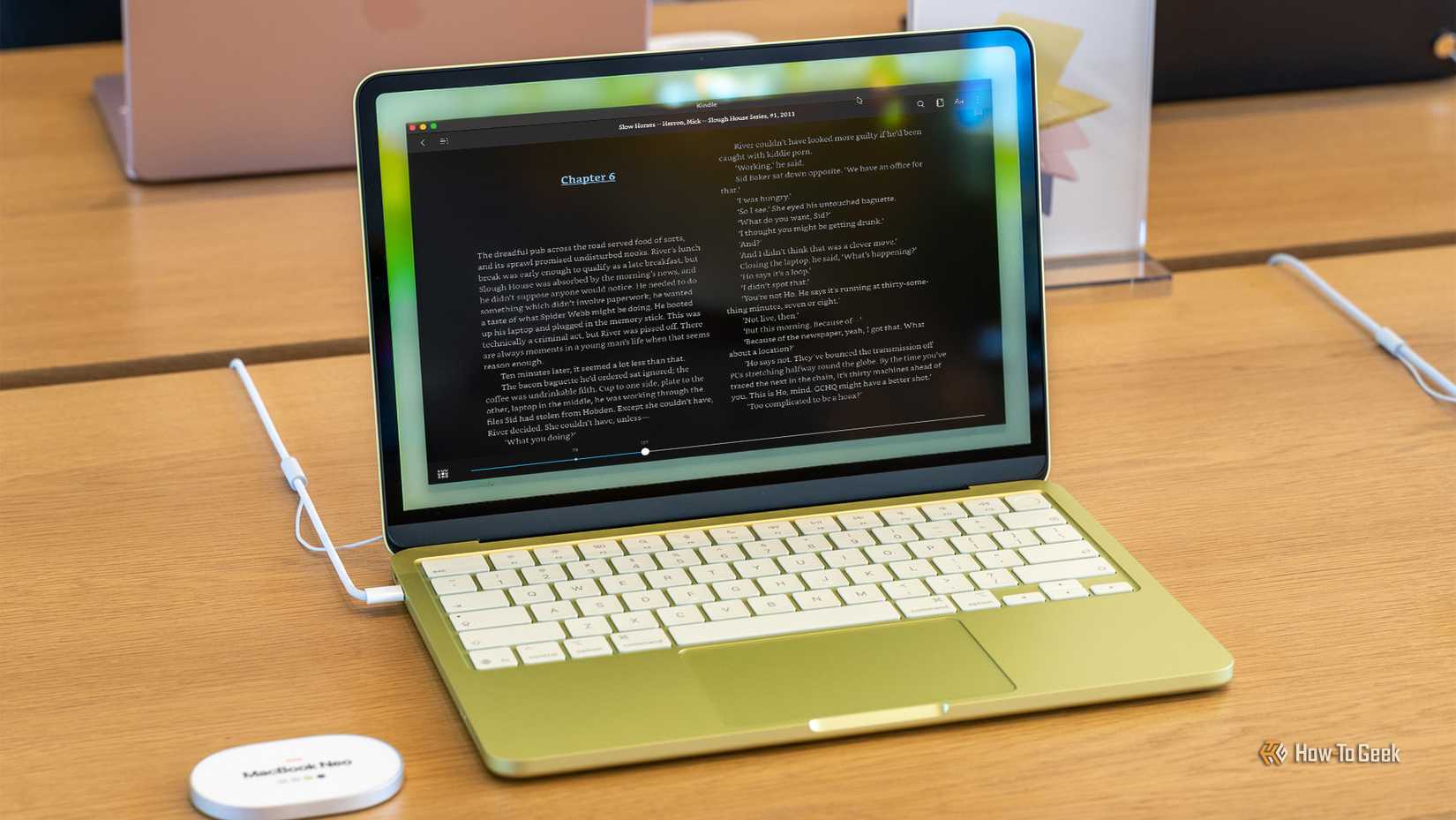 MacBook Neo with Kindle app on screen.