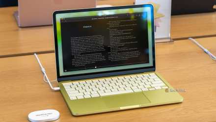 MacBook Neo with Kindle app on screen.
