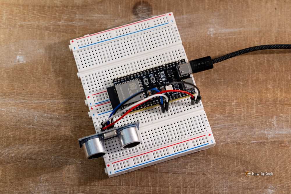 An ESP32 development board wired to a sensor on a breadboard