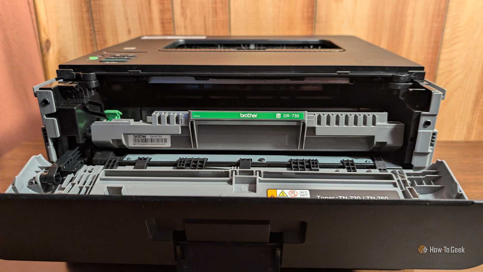 A brother monochrome laser printer with the front open. 