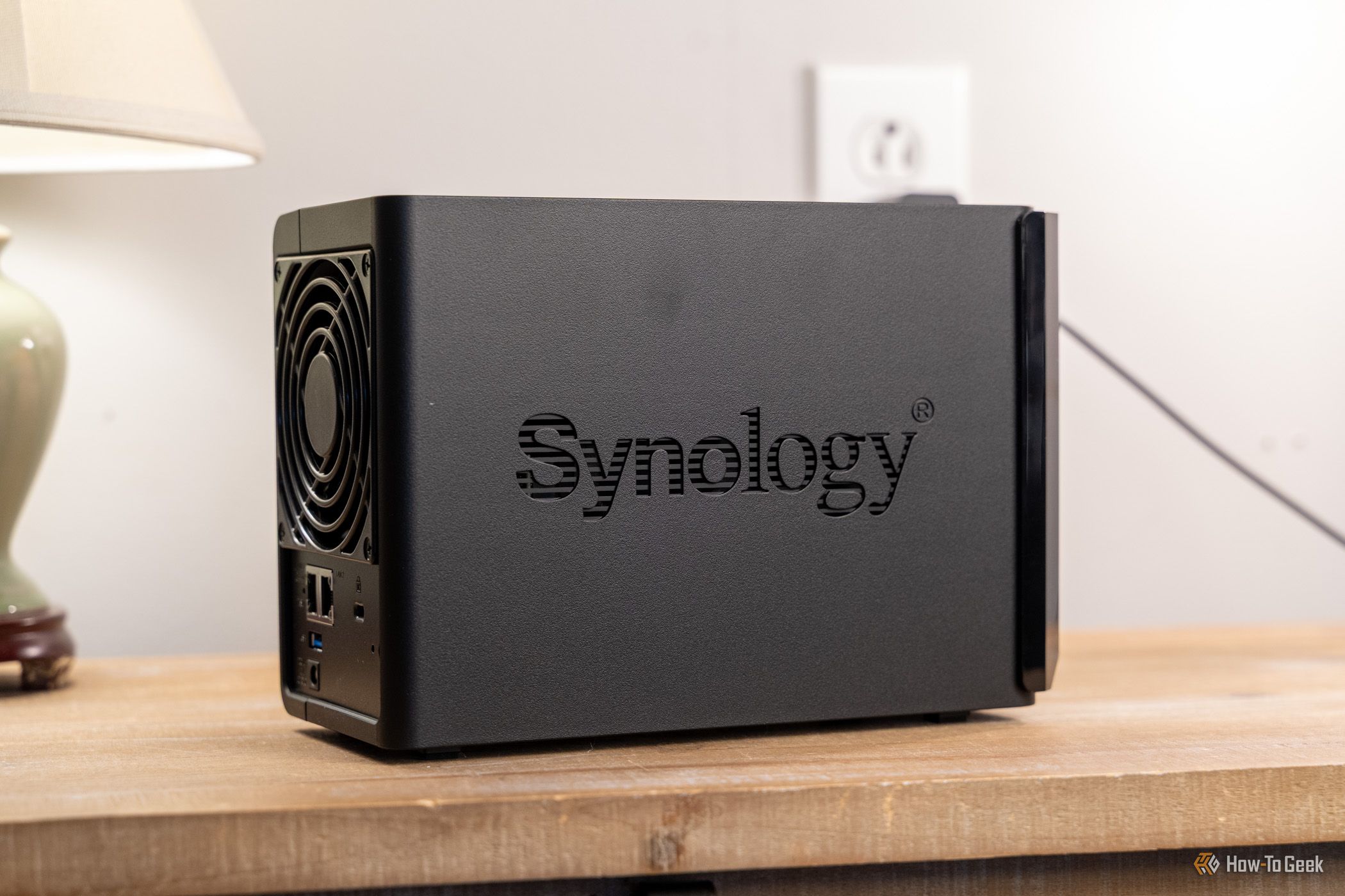 Rear side view of the Synology DS225 Plus 2-bay NAS with fan and ports visible.