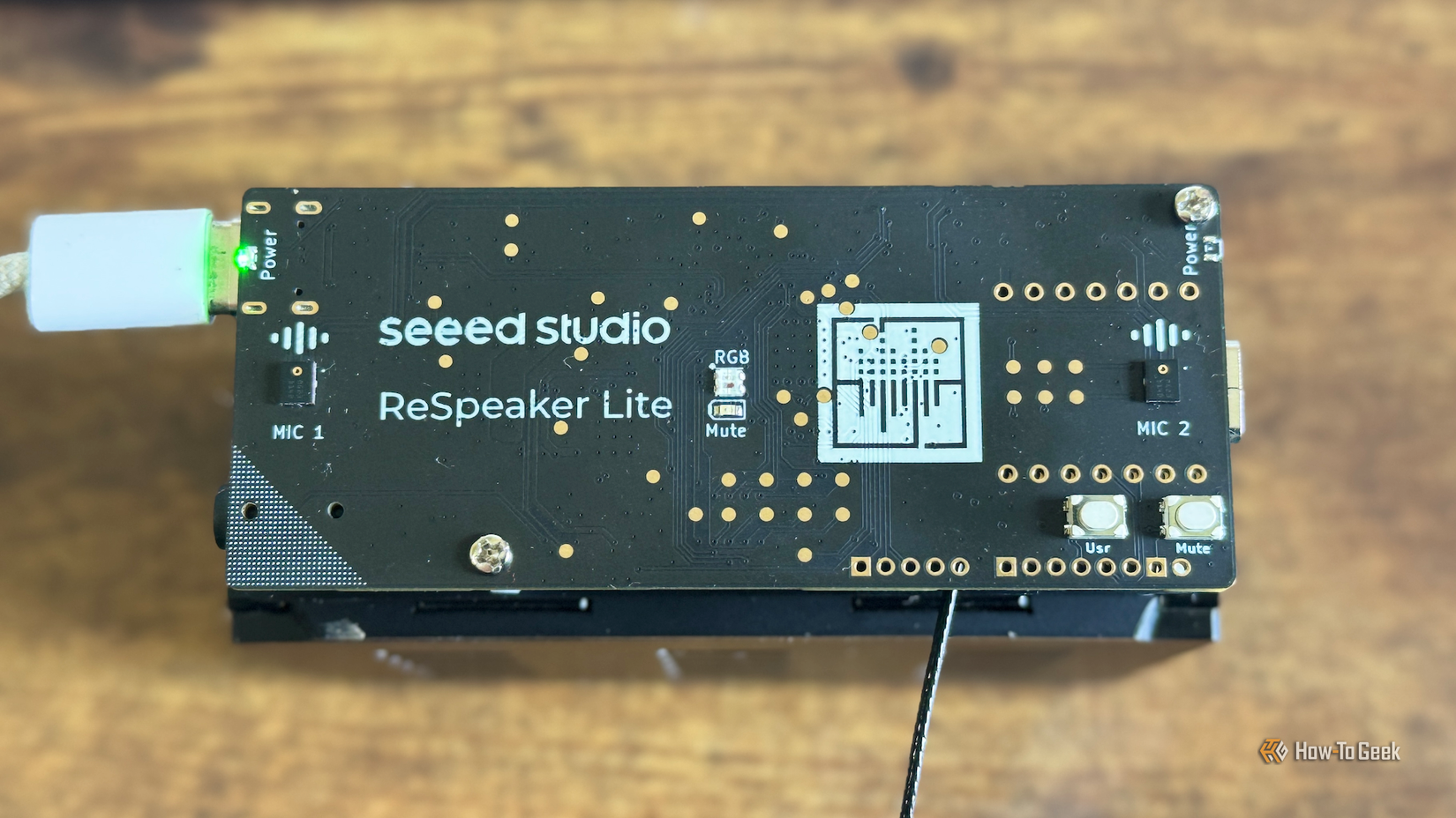 The Seeed Studio reSpeaker Lite ESP32 development board on top of a speaker.