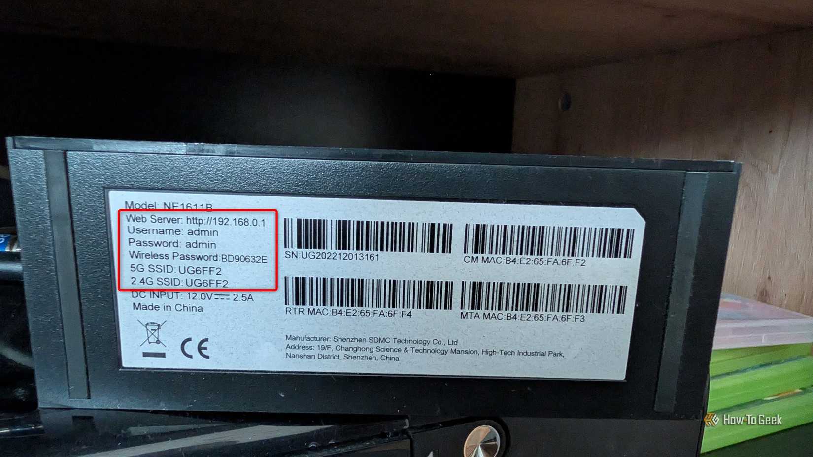 A bottom of a Wi-Fi router showing the default username, password, SSIDs, and Wi-Fi password. 