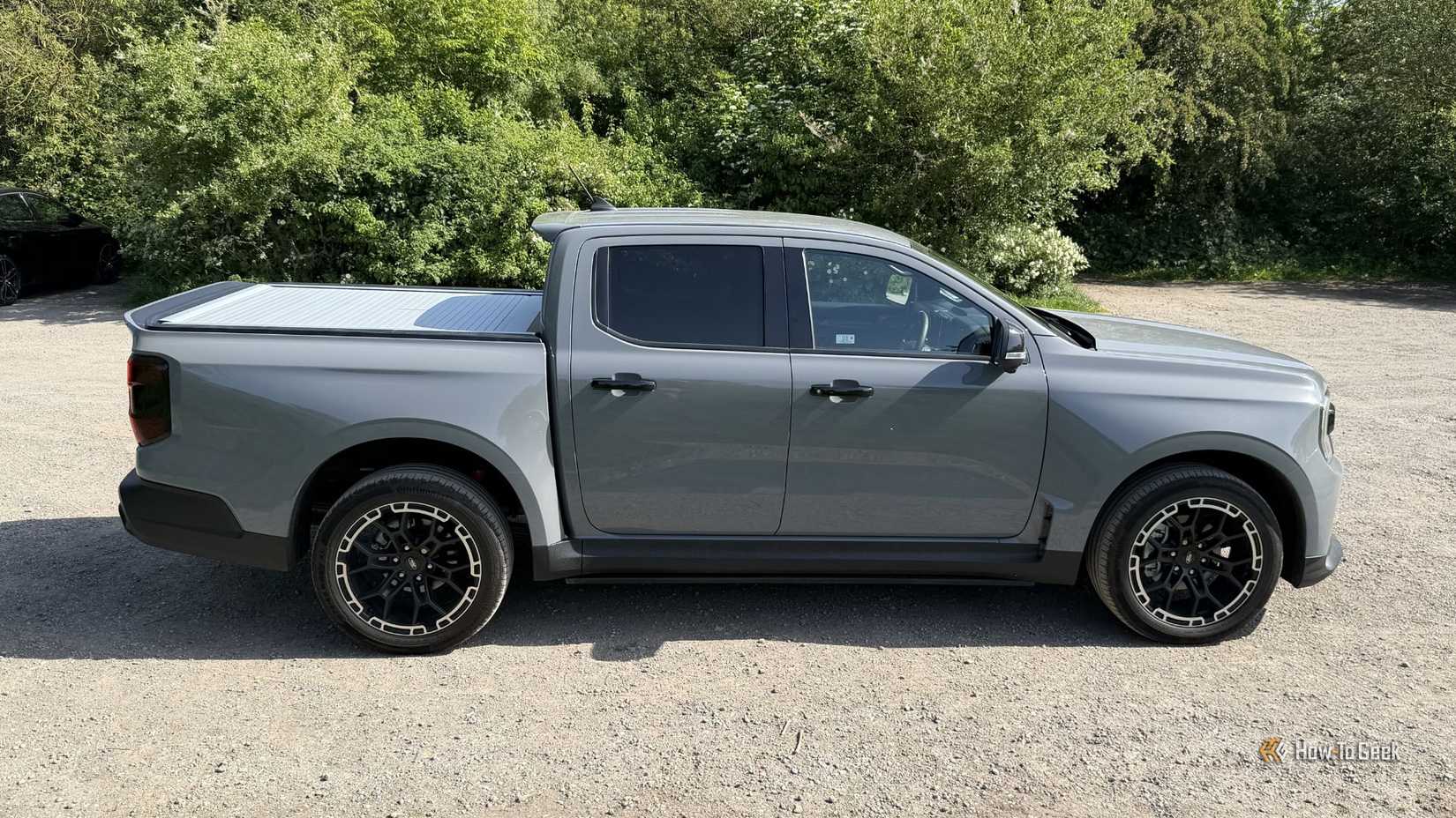Static side profile shot of a gray 2025 Ford Ranger MS-RT.