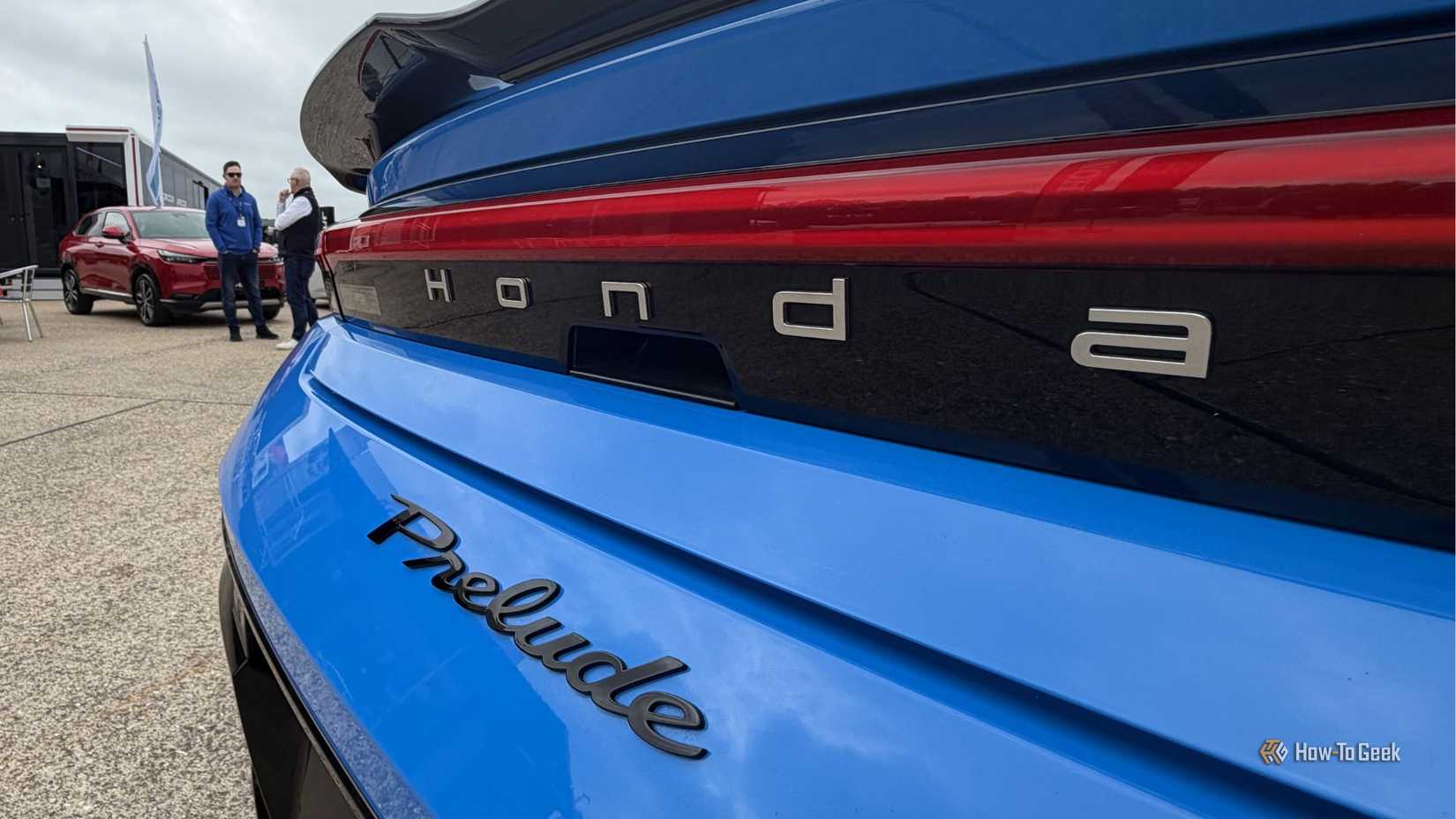 Close-up shot of the badging on the trunk of a blue 2026 Honda Prelude.