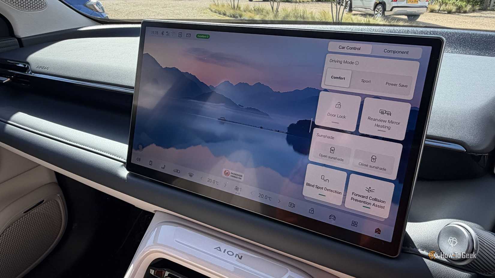 Close-up shot of the infotainment screen on the dashboard of an AION V.