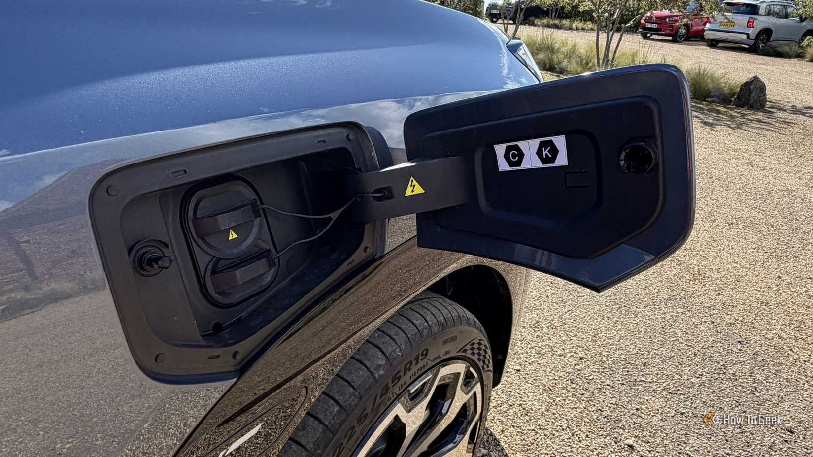Close-up shot of the charging port on a gray AION V.