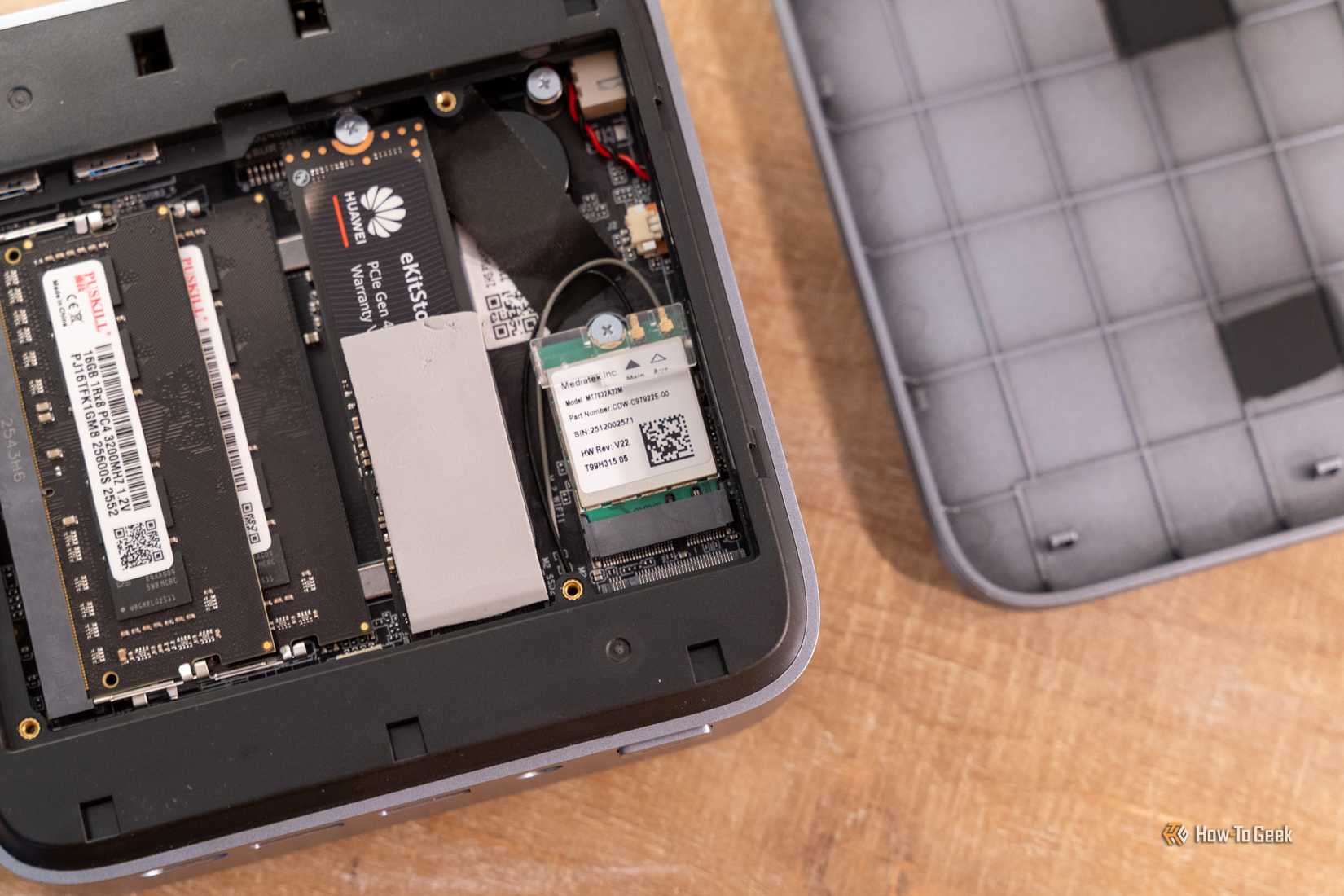 Close-up of the ACEMAGIC M5 mini PC Wi-Fi card and internal storage area.