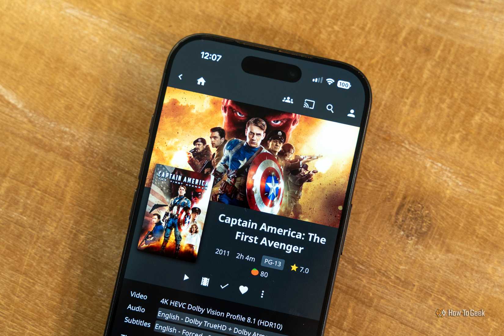 iPhone showing Captain America The First Avenger details in Jellyfin with Dolby Vision and Atmos options.
