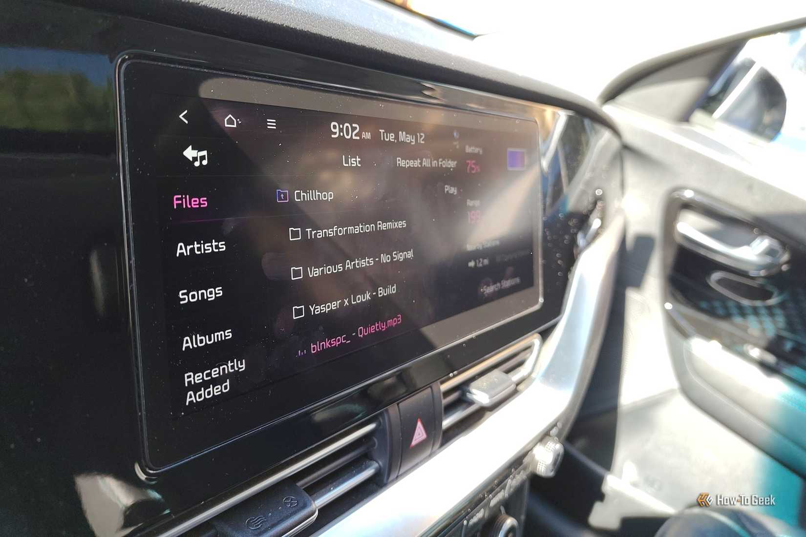 Infotainment screen in a Kia Niro EV displaying music.