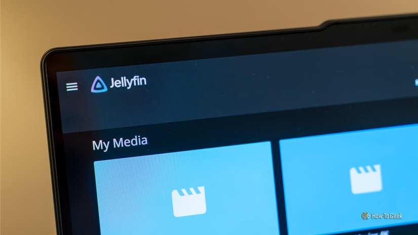 Laptop close-up showing Jellyfin logo and My Media tiles.