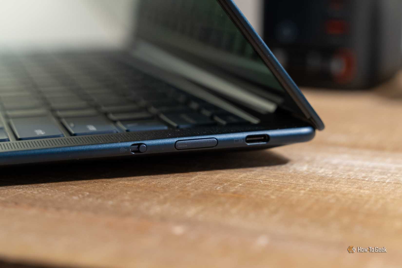 Lenovo Yoga Slim 7X side profile showing slim hinge and USB-C port.