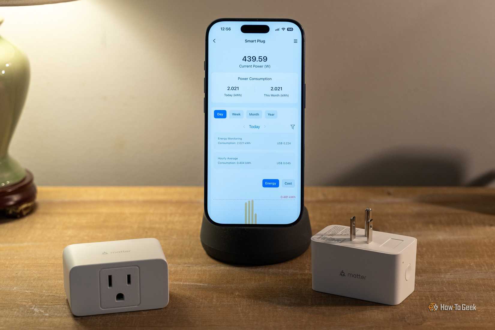meross MSS315 energy monitoring smart plug beside iPhone showing current power usage.