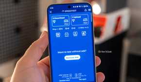 Phone showing Speedtest result with 606 Mbps download and 405 Mbps upload on AT&T.
