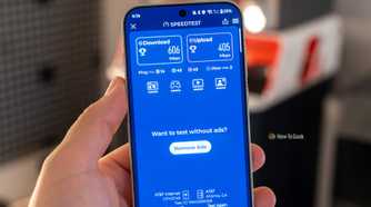 Phone showing Speedtest result with 606 Mbps download and 405 Mbps upload on AT&T.