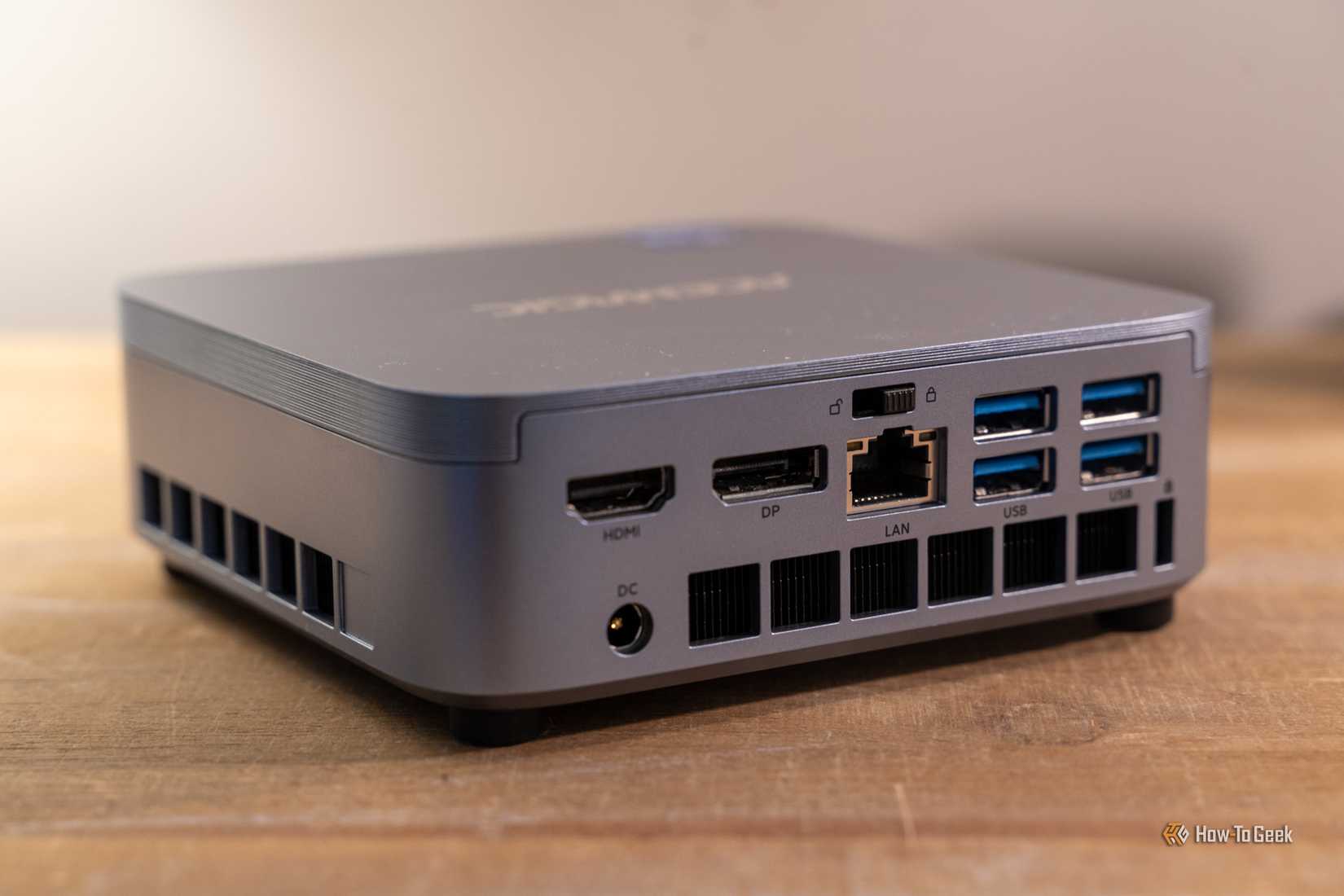 Rear ports on the ACEMAGIC M5 mini PC with HDMI DisplayPort LAN and USB connections.