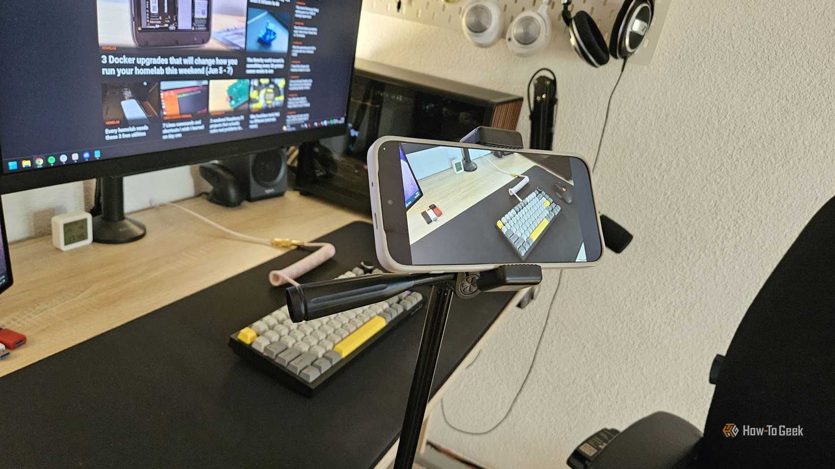 A smartphone mounted on a tripod recording a time-lapse video.